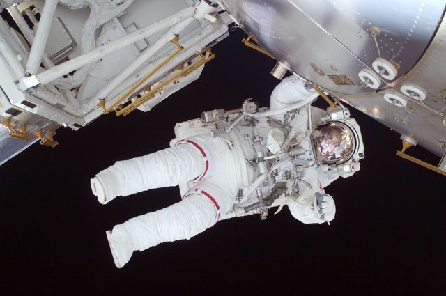 person in white astronaut suit 39651